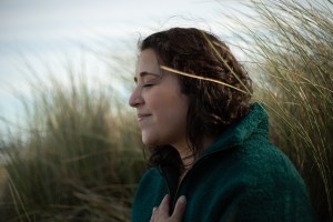 Dr Amy D'Sa
eyes closed in sand dune meditating 
